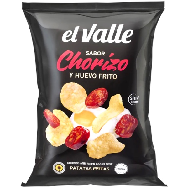 El Valle Chorizo y Huevo Frito 150 gr. El Valle Chorizo y Huevo Frito è una delle varianti più particolari della linea gourmet El Valle. Queste patatine si ispirano a uno dei sapori più iconici della cucina spagnola: chorizo speziato e uovo fritto. Il gusto è ricco e intenso, con note affumicate e leggermente speziate del chorizo bilanciate dalla componente cremosa e sapida dell’uovo fritto. Il risultato è uno snack deciso, diverso dalle classiche chips e perfetto per chi cerca sapori internazionali fuori dal comune.